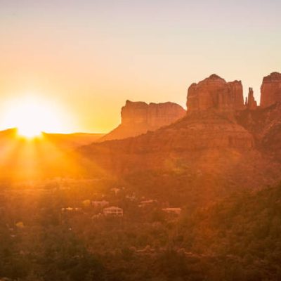 Sun rising over Sedona, Arizona with Cathedral Rock in the frame